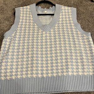Size: small. Blue and white sweater vest. Oversized. Thick sweater.